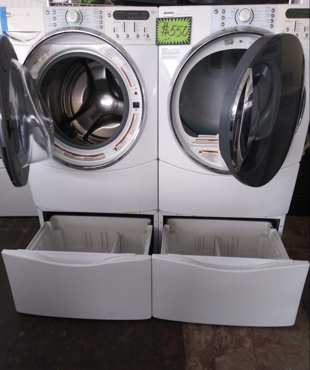 Kenmore front load washer and dryer set with pedestals in excellent