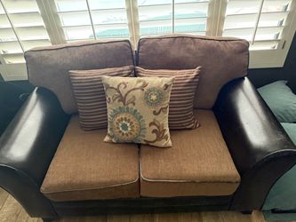 Brown and leather loveseat