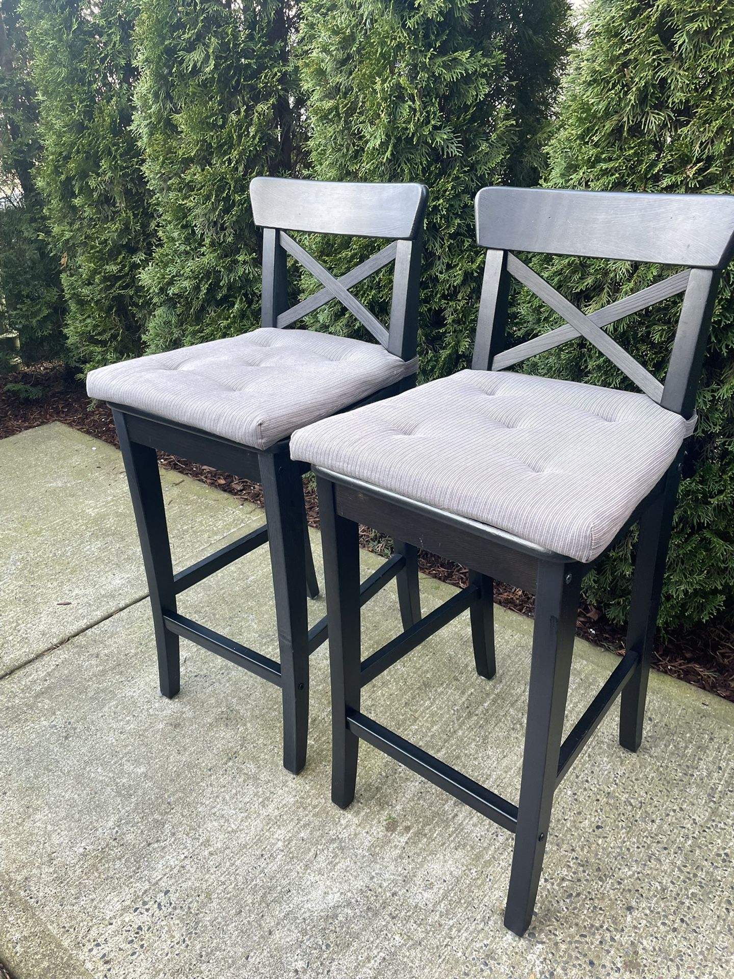 two solid wood counter top chairs with cushions removable in great condition 25 in H