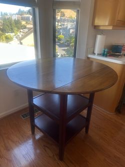 Wooden drop leaf counter height round table
