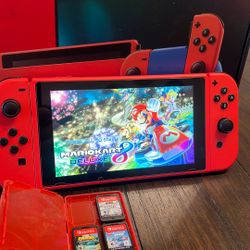 Nintendo Switch Mario Red & Blue Edition. Perfect Condition With Screen Protector. System Is Complete With Everything 
