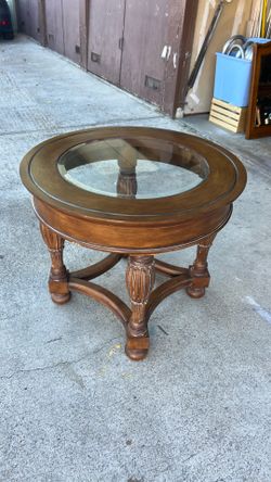 Elegant end table with glass insert.