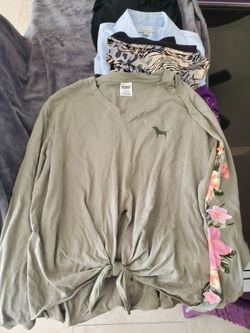 Pink top with flowers on sleeve tie front size M  alot more wens clothes