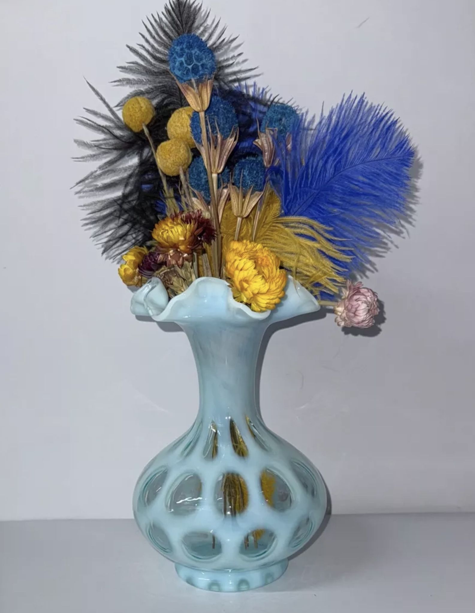 Vintage striking blue opalescent hue is complemented by the classic coin dot pattern, a signature of the Fenton art glass line