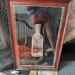 "Framed Slumped Belvedere Bottle," "Flattened Glass Bar Art," or "Upcycled Vodka Decor