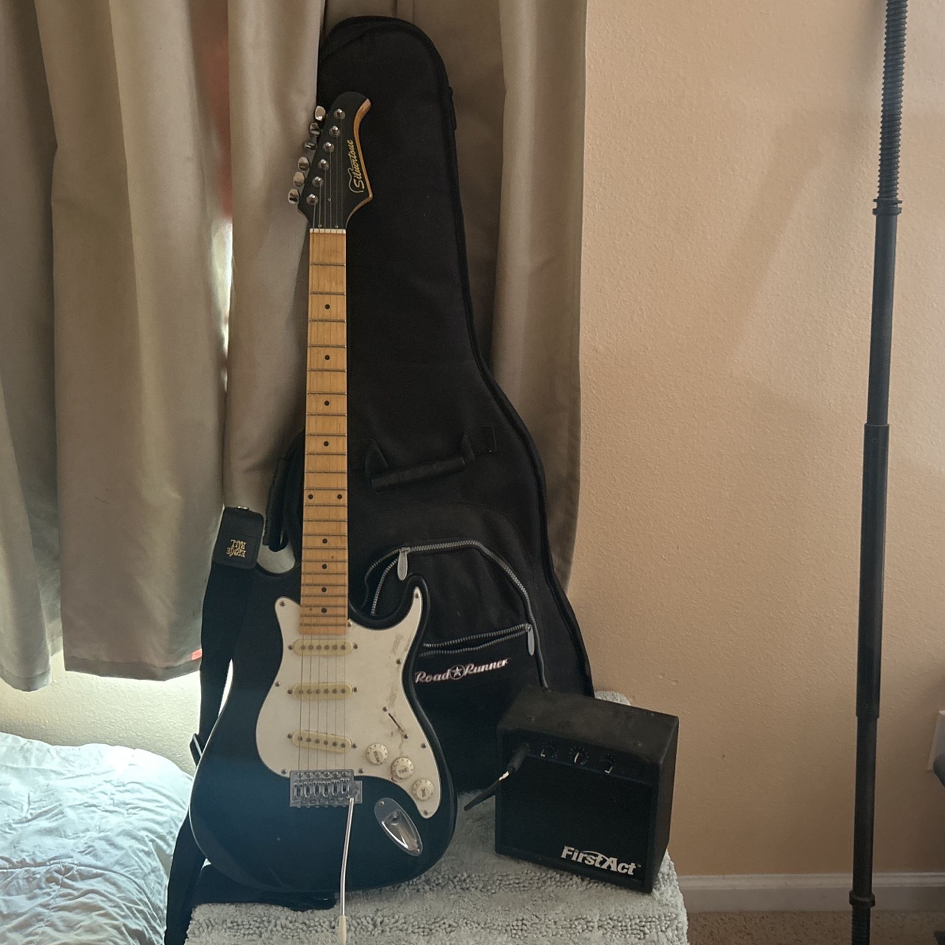 Silvertone 6 String With First Act Amp.