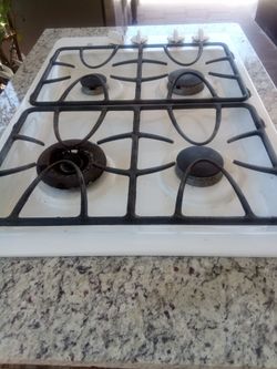 General Electric gas stove top with wood cainets