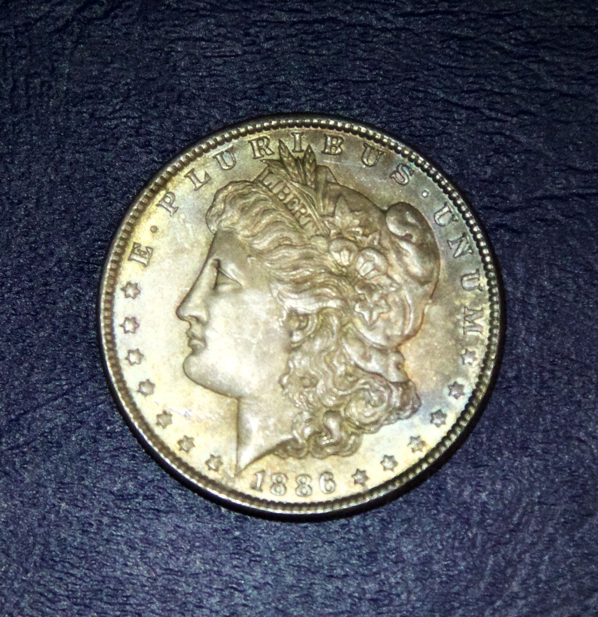 1886 āPā. AU Morgan Silver dollar w Rainbow Toning