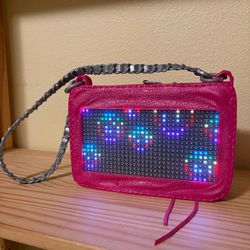 Project MC squared light up purse. Projects different images and can be programmed to project your own message.