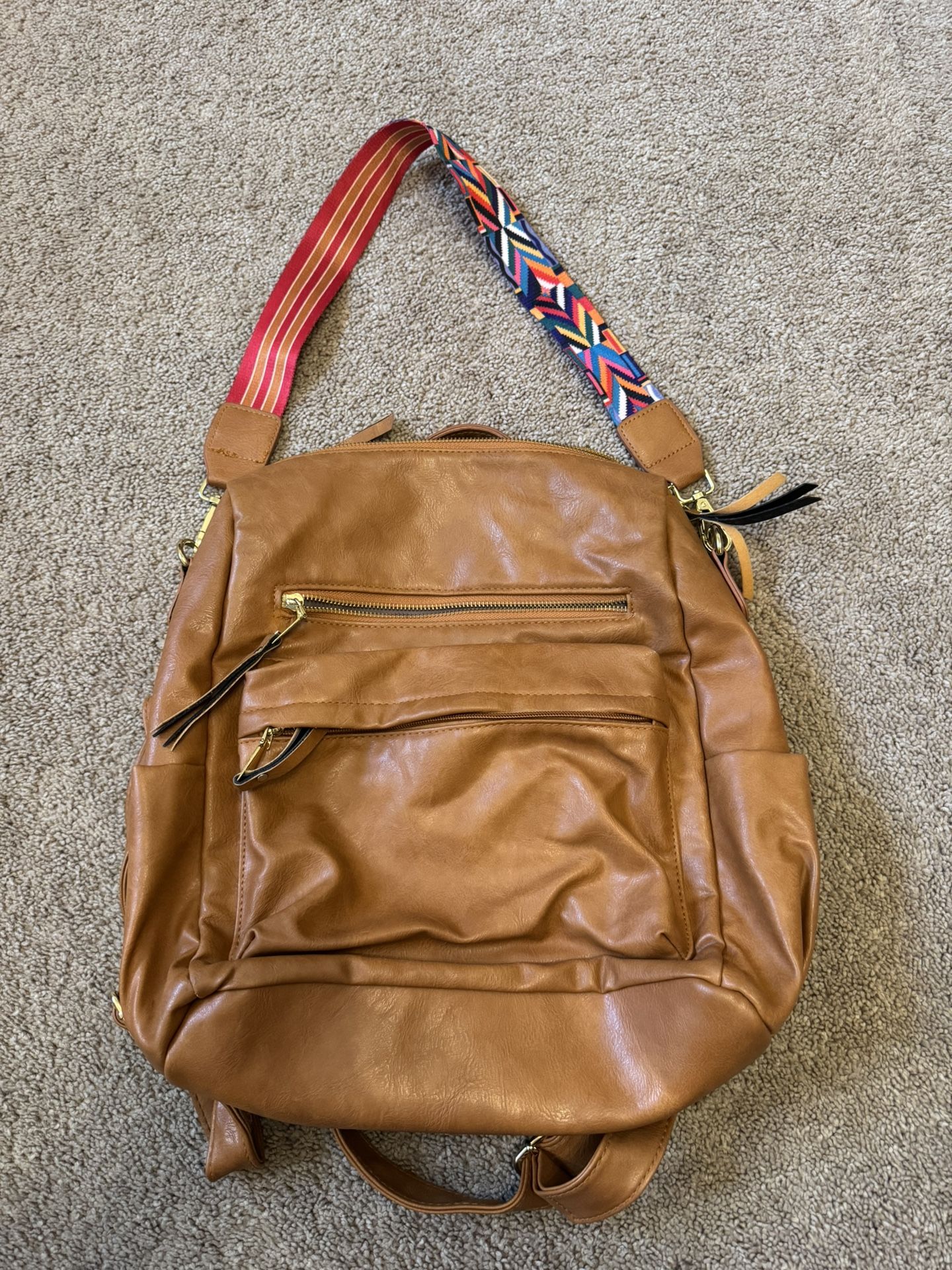 Brown Leather Backpack with Colorful Strap