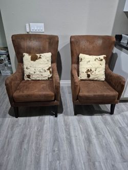 2 piece set of brown microfiber nailhead Accents wingback armchairs and two pillows,  in very good condition
