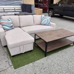 Brand New Secrtonal 
Pull Out Bed 
White & Grey (Beige)
Flannellete Fabric 
Pillows Included 
Reversable Chaise W/ Storage
Coffe Table & Sofa Table In