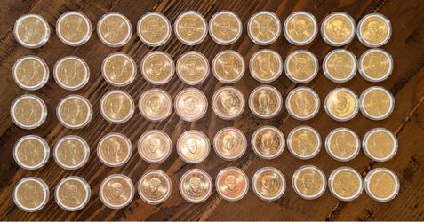 Trump $1 coins x50. Individual plastic protective cases.