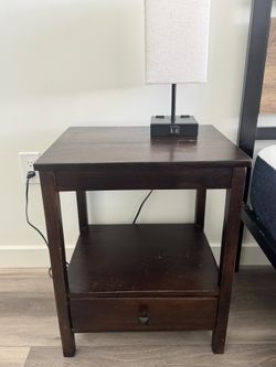 dark brown wood nightstand and lamp
