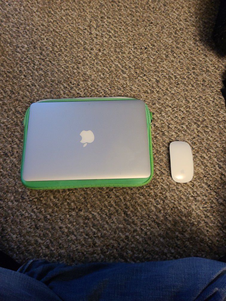 Apple MacBook with mouse