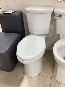 Kohler Irvine Two Piece Toilet, Fully Skirted, Seat Included, Available For Pick Up