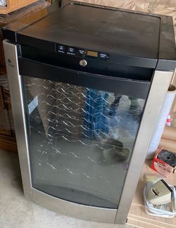 Model#GE Wine Cooler Model PWR04FANDBS, Temperature Control, Lighted, Like New!