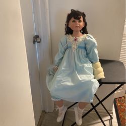 Porcelain doll with soft body/ottoman
