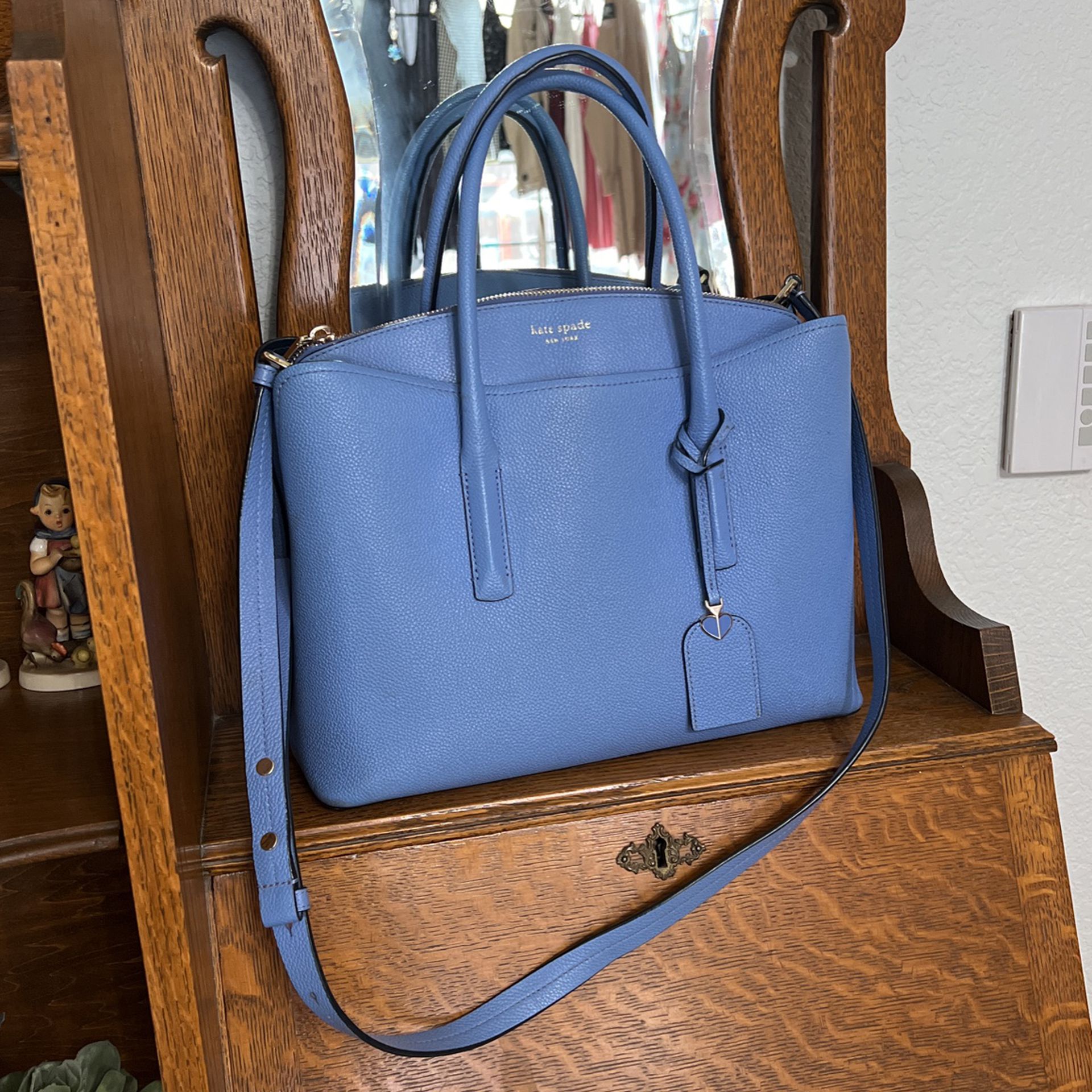 Beautiful blue, Kate Spade purse with handles and shoulder strap