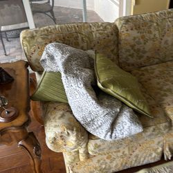 Yellow and green brocade sofa used