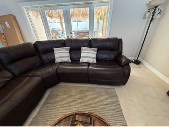 Electric reclyning sofa with coffee table and rug