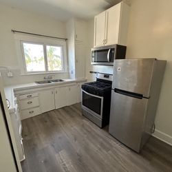 Whirlpool Stainless Steel Refrigerator, Microwave and Stove
