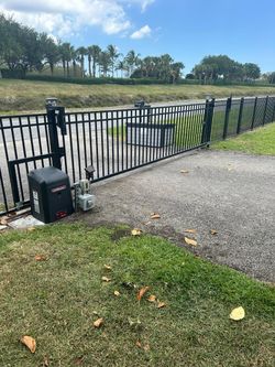 Electric gate shaking, dragging, or jamming? I fix chain, rollers, and tracks