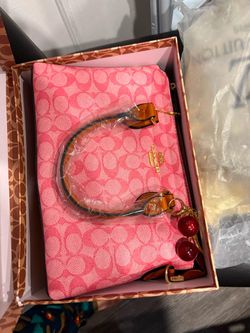 Pink coach bag with cherry charm