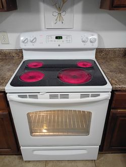 GE, White Electric Stove.