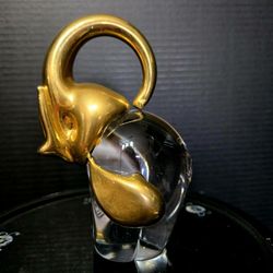 Mid 20th Century Murano glass elephant figurine featuring a clear glass body and a gold-colored or gold-plated head and trunk 5.5"