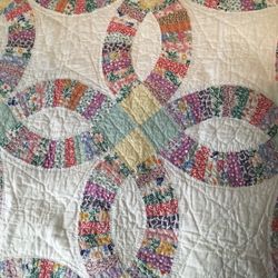 Vintage Twin Hand Sewn and Signed Double Wedding Ring Quilt circa 1930’s.  Size is 86” by 72” - fits twin sized bed. 