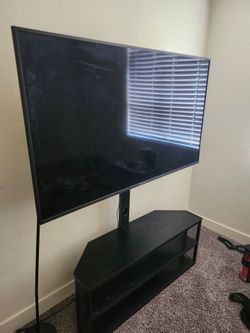 57in sceptre 4k tv with stand.