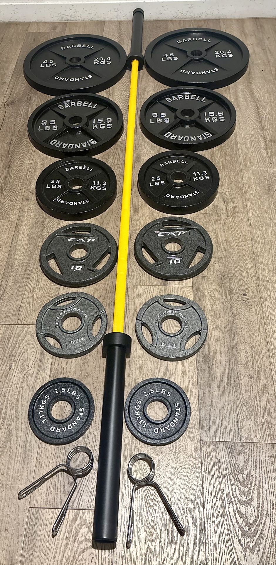 Beautiful BRAND NEW  Olympic Equipment: Bar And Full Set Of Weight Plates. Total Of 290 lbs