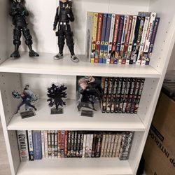 Shelf With Figures And Manga