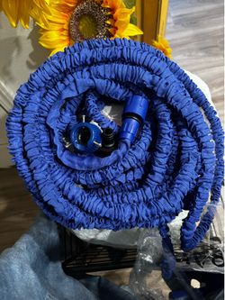150’ long hose that doesn’t tangle and comes with sprayer
