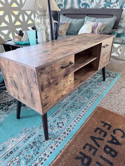 Tv stand with dark wood stain finish