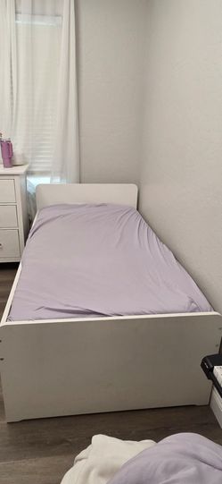 Twin size white bed frame.