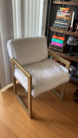 Gold and white fur chair
