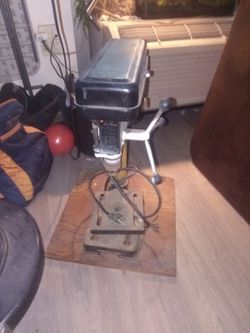 Black and Decker drill press mounted on plywood