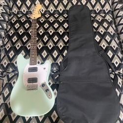 fender electric guitar with a guitar sleeve