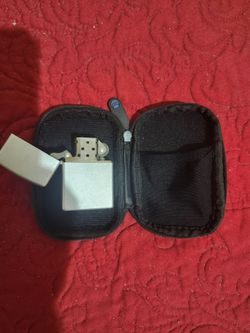Collectible plain December 2004 Zippo lighter with case