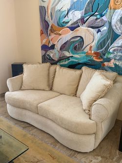 Cream Upholstered Loveseat with Matching Pillows