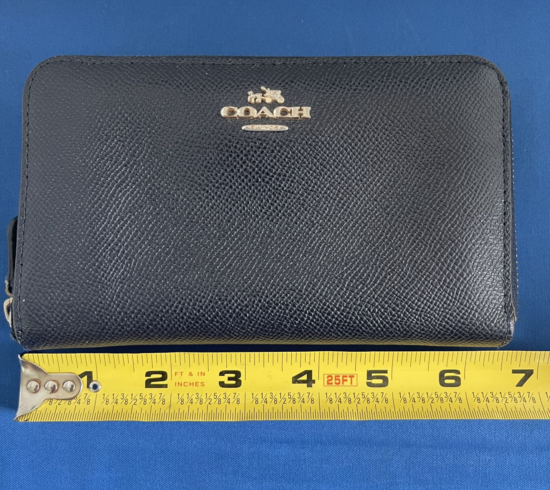 Women’s Coach Navy blue zippered pebbled leather wallet. In Jupiter