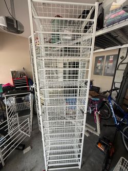 Two white metal drawer racks