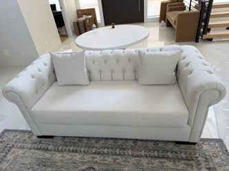 White tufted sofa