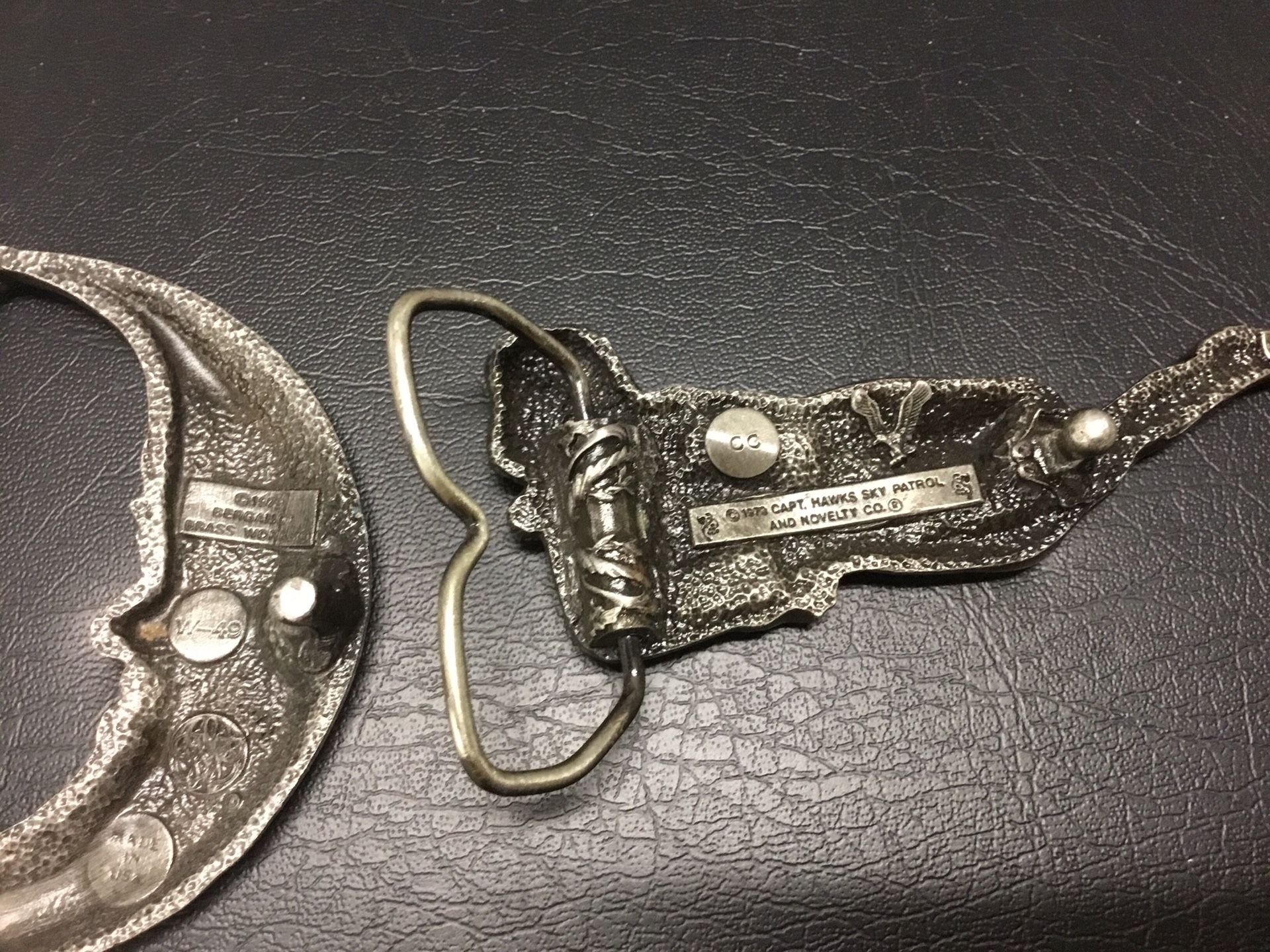 Nude Woman Bergamot and Capt Hawks Sky Patrol Belt Buckles