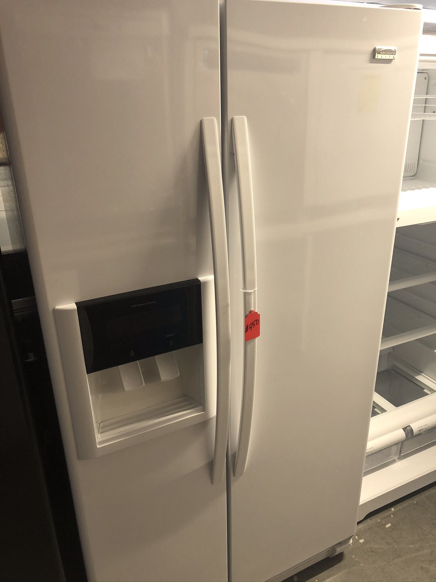 Used kenmore Elite side by side fridge. 1 year warranty