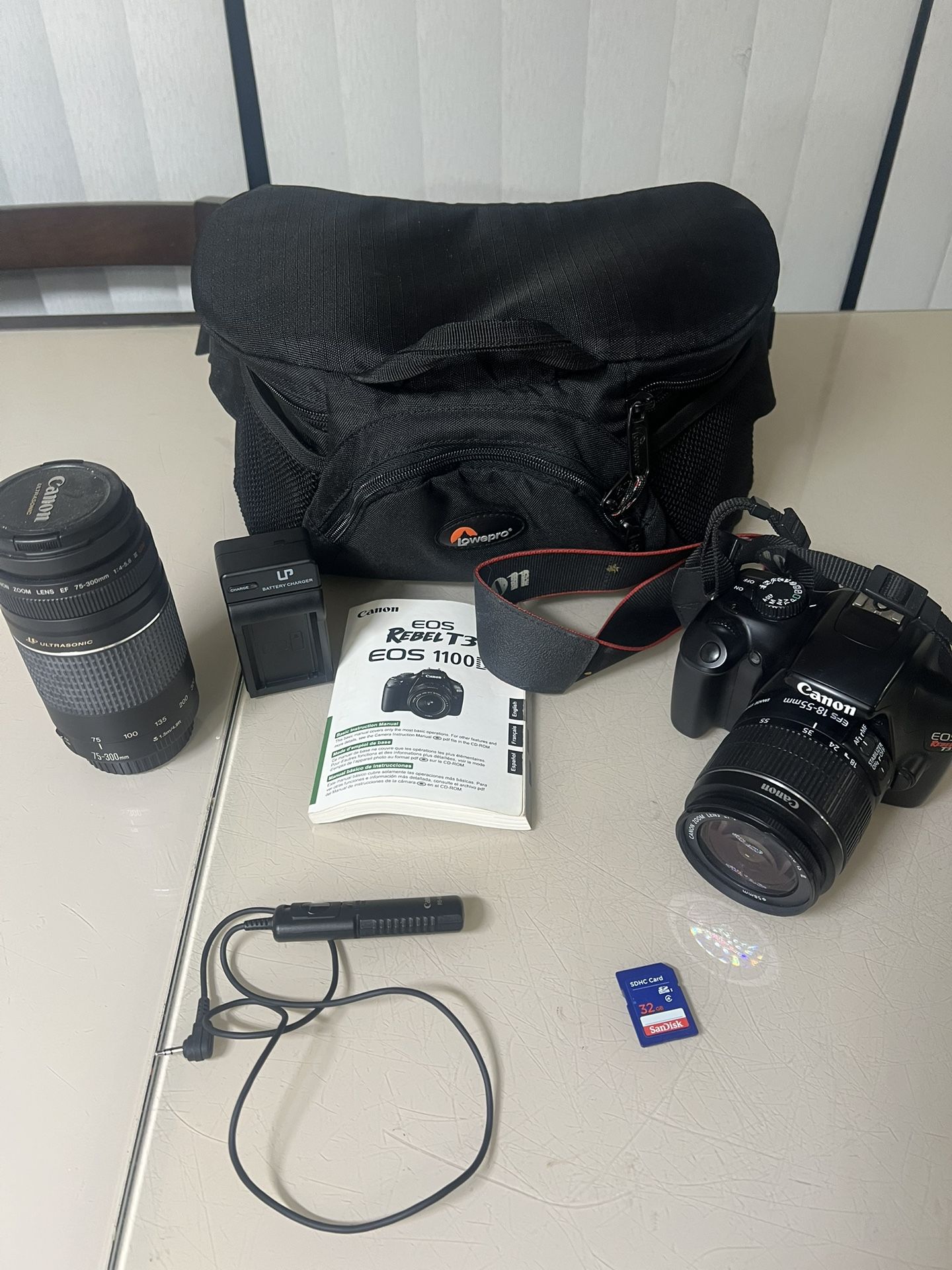 Canon EOS Rebel T3 / 1100D 12.2MP Digital SLR Camera W/case & Extras. Used in very good condition with minor cosmetic blemishes such as light scratch