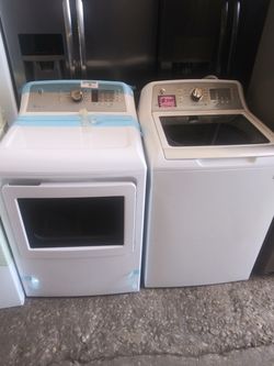 New scratch and dent GE top load washer and dryer set