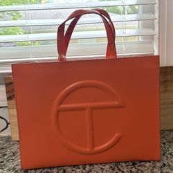 Orange Tel Far Bag. 